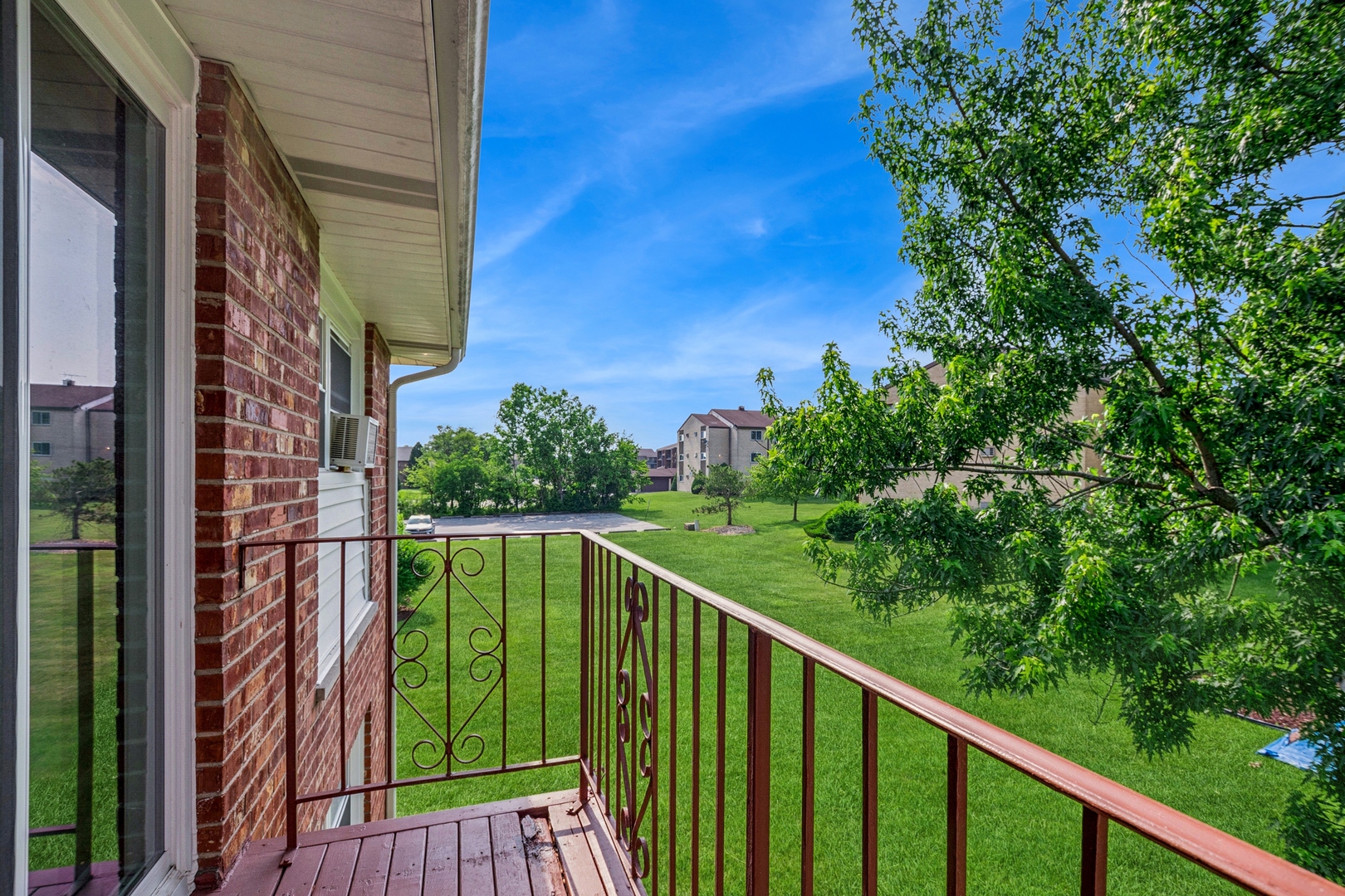 15290 El Cameno Terrace, Unit 2W Orland Park, IL 60462 - Photo 3 of 14 a balcony with trees in front of it