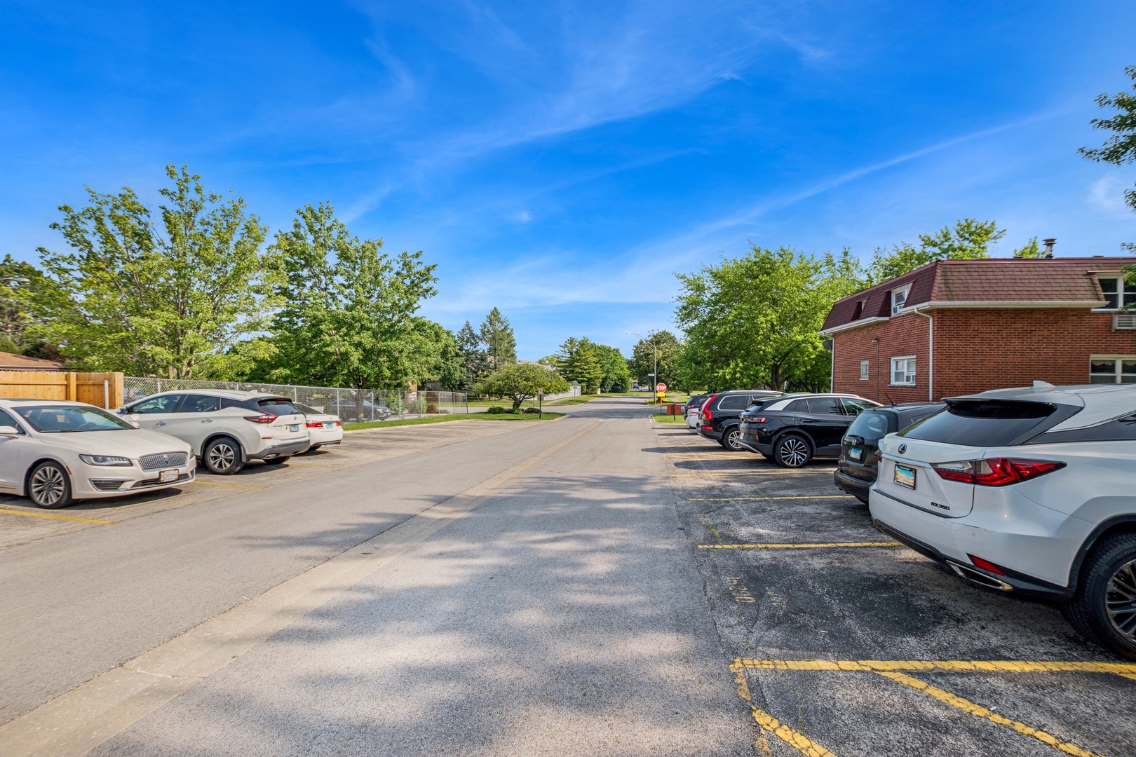 15290 El Cameno Terrace, Unit 2W Orland Park, IL 60462 - Photo 4 of 14 a view of a street with cars on road