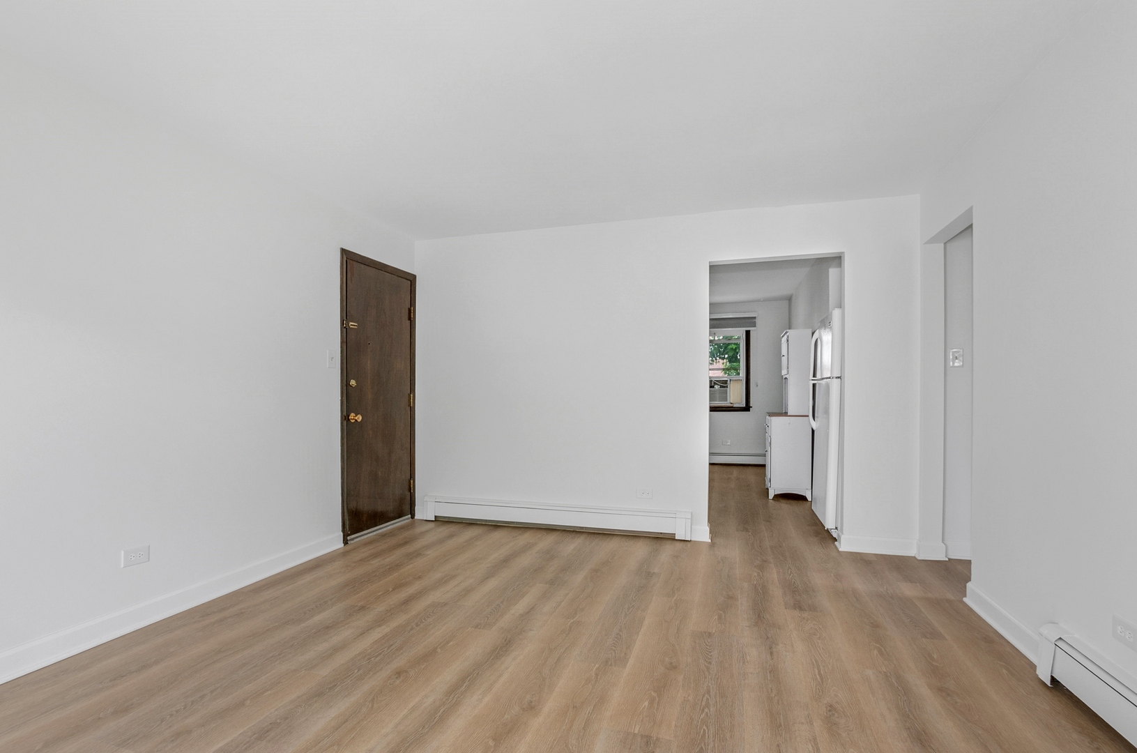 15290 El Cameno Terrace, Unit 2W Orland Park, IL 60462 - Photo 10 of 14 a view of wooden floor in an empty room