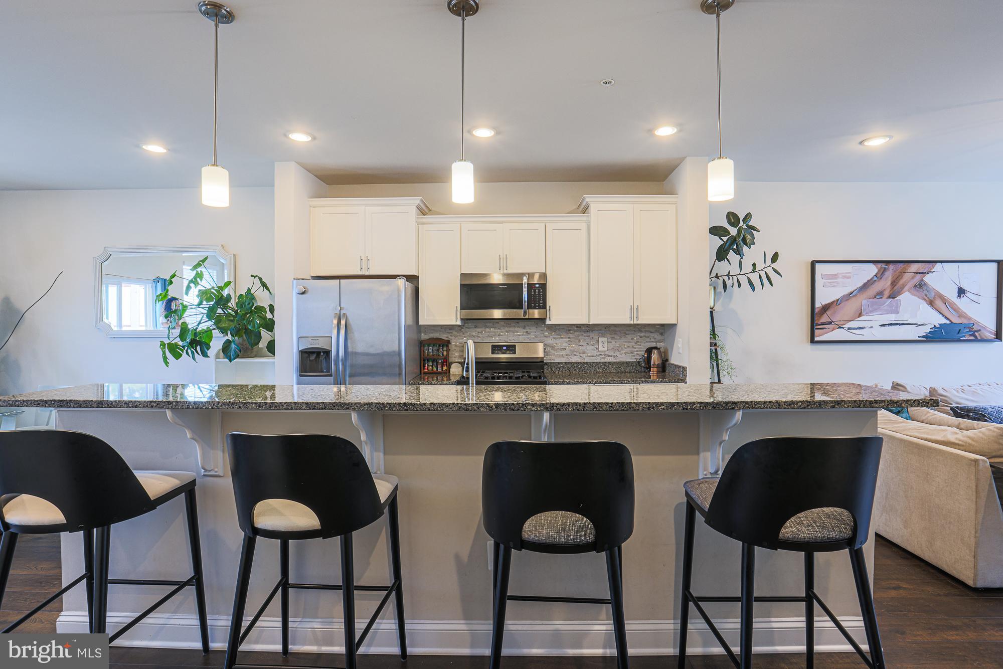7104 Druce Way Hanover, MD 21076 - Photo 8 of 31 barstool seating at kitchen
