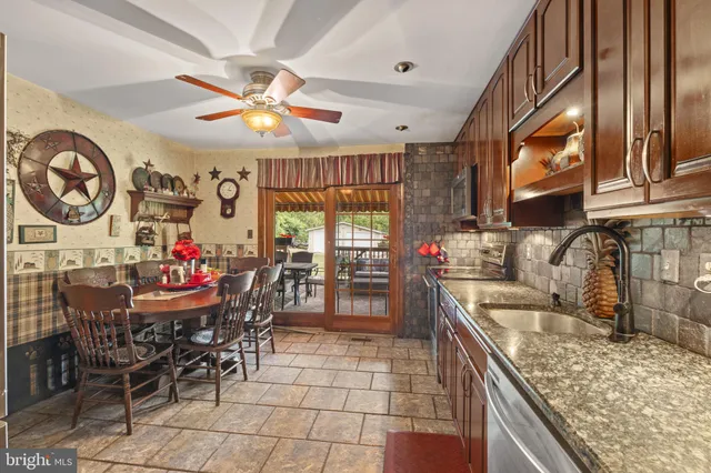 a view of a dining room with furniture window and outside view