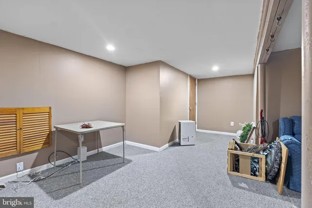 a view of a livingroom with furniture and windows