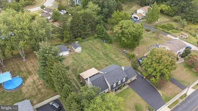 an aerial view of a house with outdoor space