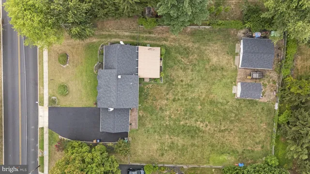 aerial view of a house with a yard
