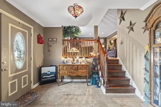 a view of entryway with stairs and furniture