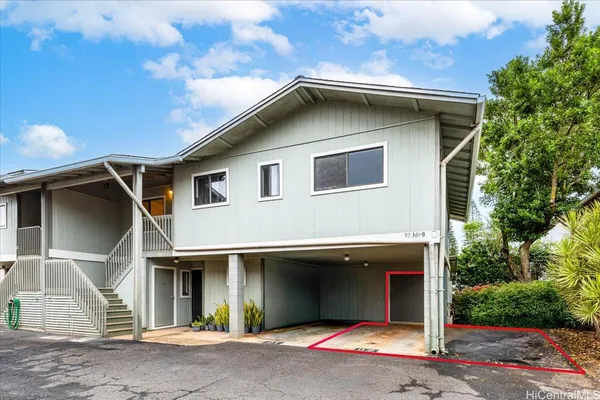 a front view of a house with garage