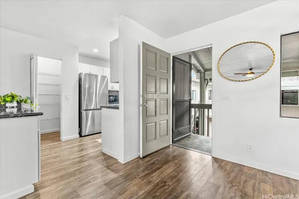 a kitchen with stainless steel appliances a refrigerator and a stove