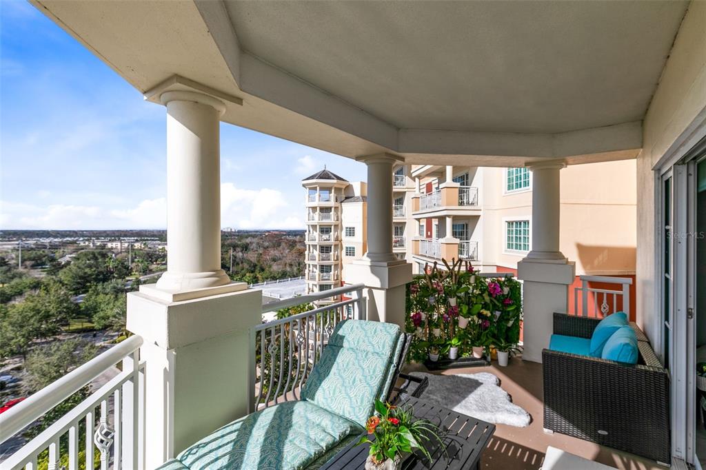 7593 Gathering Drive, Unit 802 Reunion, FL 34747 - Photo 12 of 34 a view of a balcony with chairs