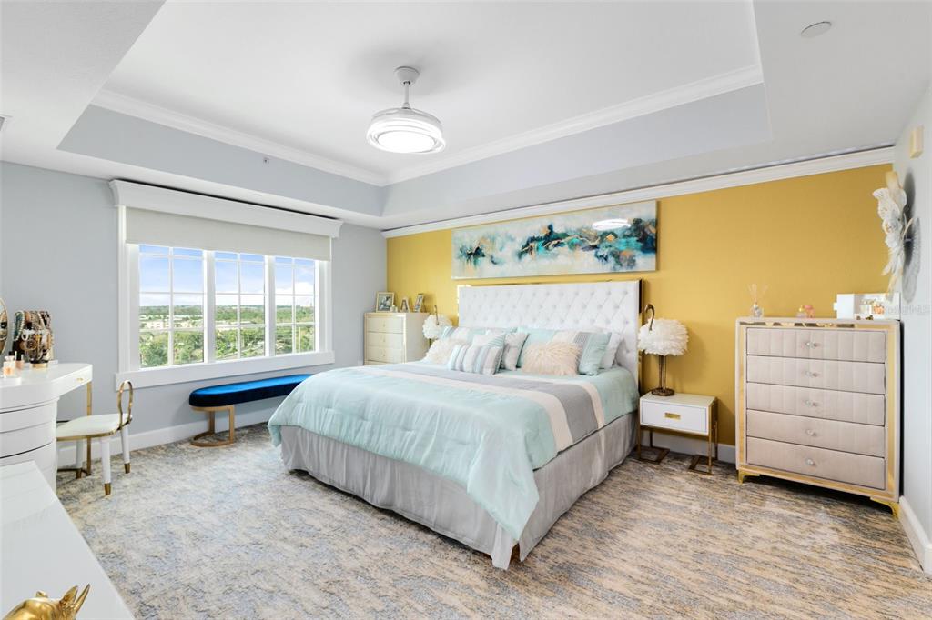 7593 Gathering Drive, Unit 802 Reunion, FL 34747 - Photo 14 of 34 a bedroom with a bed and a window