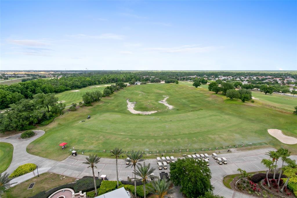 7593 Gathering Drive, Unit 802 Reunion, FL 34747 - Photo 26 of 34 a view of a lake with a yard