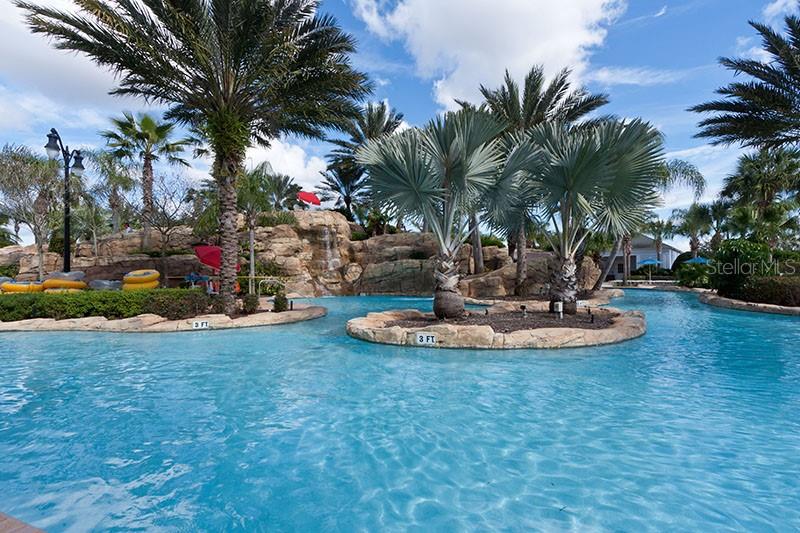 7593 Gathering Drive, Unit 802 Reunion, FL 34747 - Photo 34 of 34 a view of a backyard with palm trees