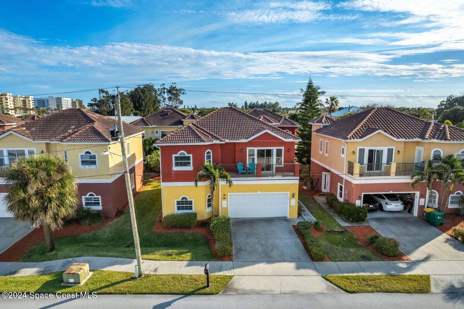16 South Court Indialantic, FL 32903 - Photo 13 of 20 a front view of multiple houses with yard