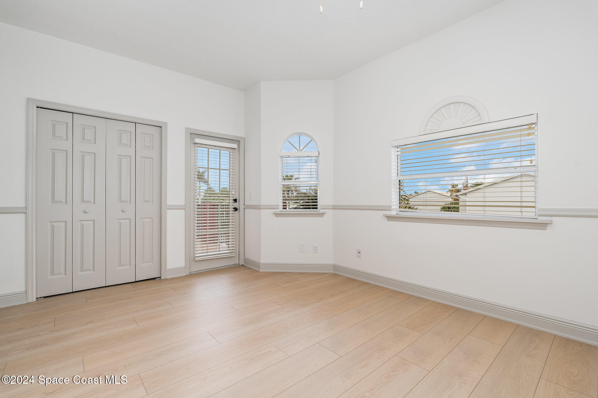 16 South Court Indialantic, FL 32903 - Photo 17 of 20 an empty room with windows and wardrobe