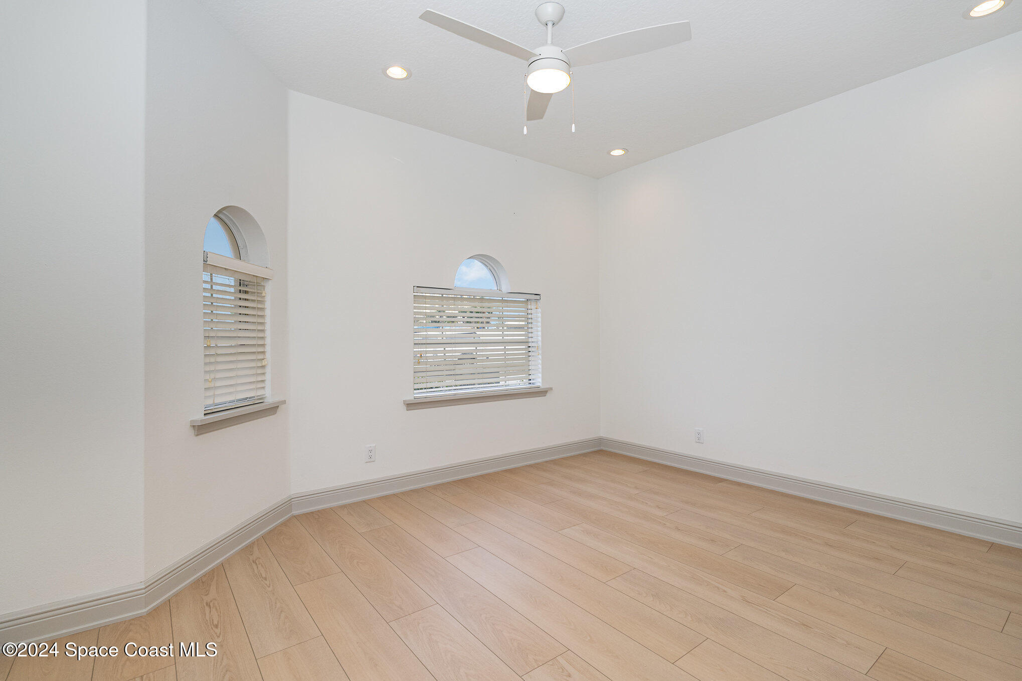 16 South Court Indialantic, FL 32903 - Photo 4 of 20 wooden floor in an empty room with a window
