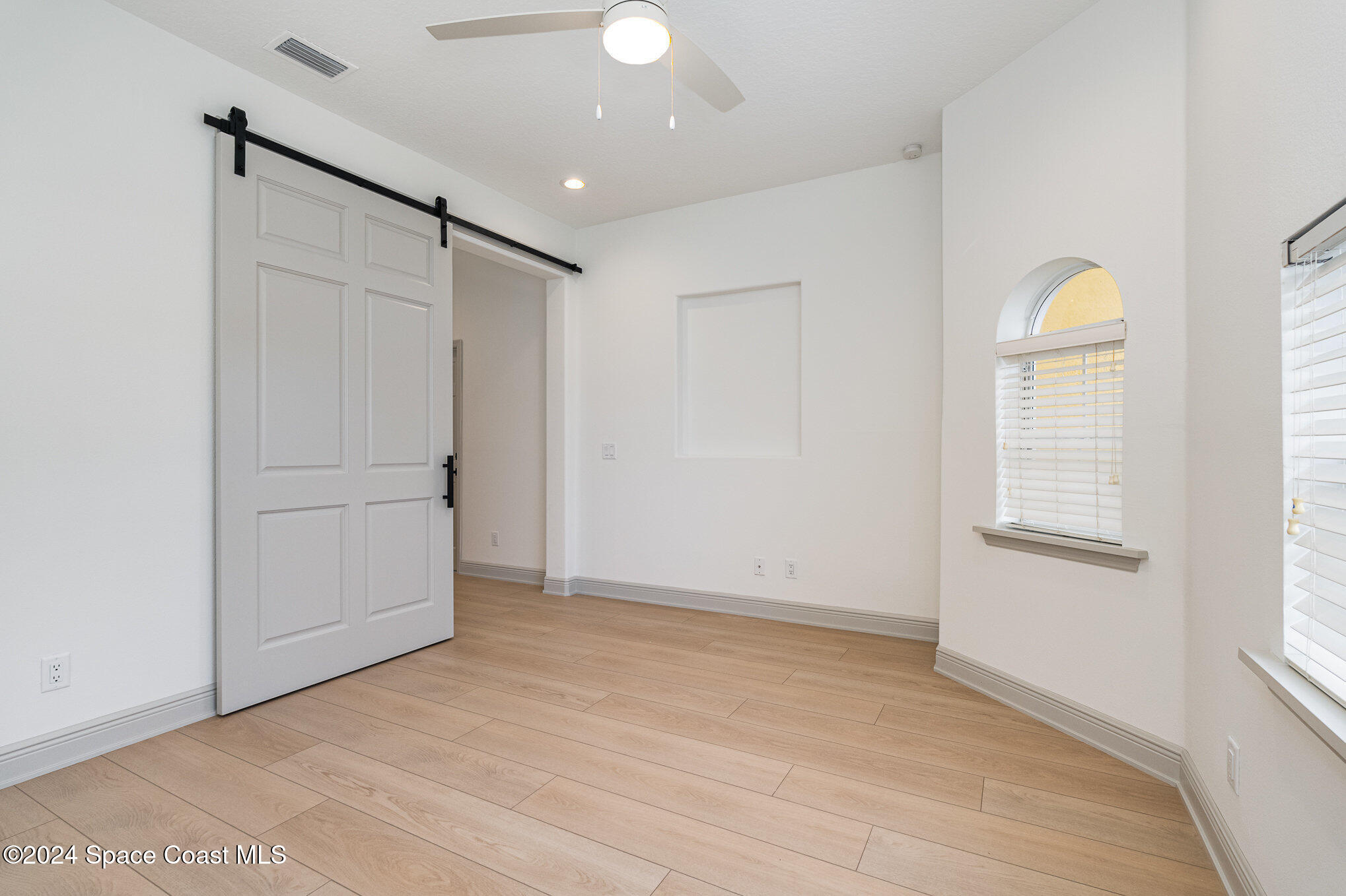 16 South Court Indialantic, FL 32903 - Photo 5 of 20 an empty room with windows and closet