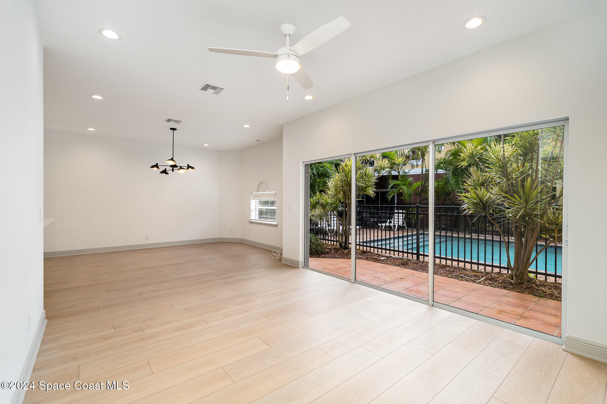 16 South Court Indialantic, FL 32903 - Photo 9 of 20 a view of a livingroom with a ceiling fan and window