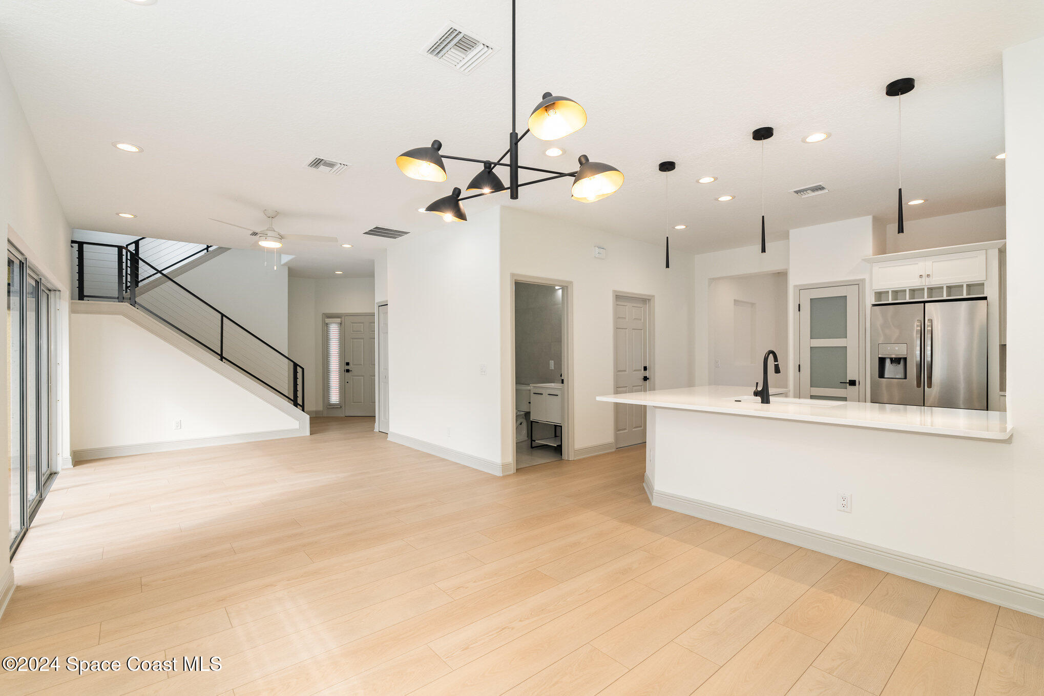16 South Court Indialantic, FL 32903 - Photo 10 of 20 a view of a kitchen with furniture and a ceiling fan