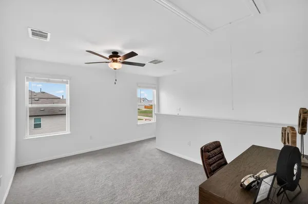 a view of workspace with lounge chair