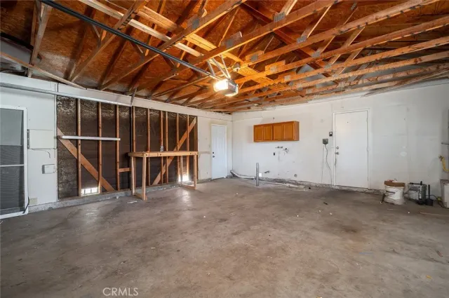 a view of empty room with wooden ceiling