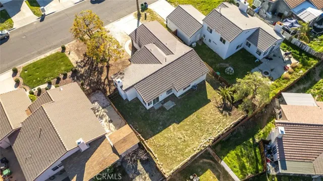 an aerial view of house with yard