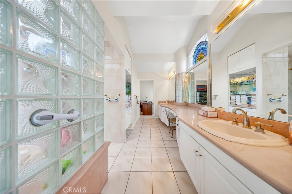 2835 Devonport Road San Marino, CA 91108 - Photo 39 of 54 a large bathroom with a sink a mirror a vanity and a shower