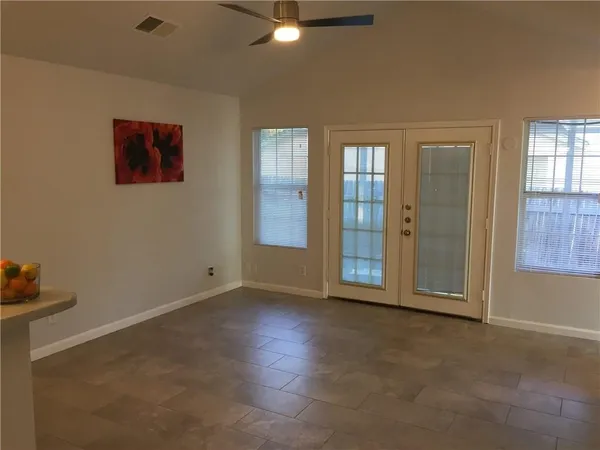 an empty room with windows