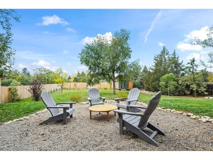 a backyard of a house with outdoor seating