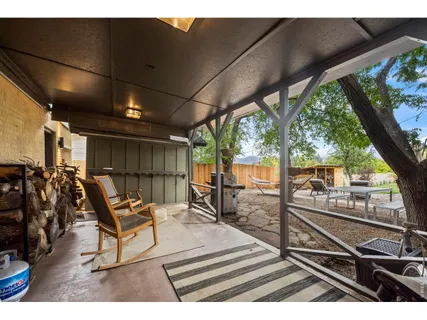 a sitting area with view of a swimming pool
