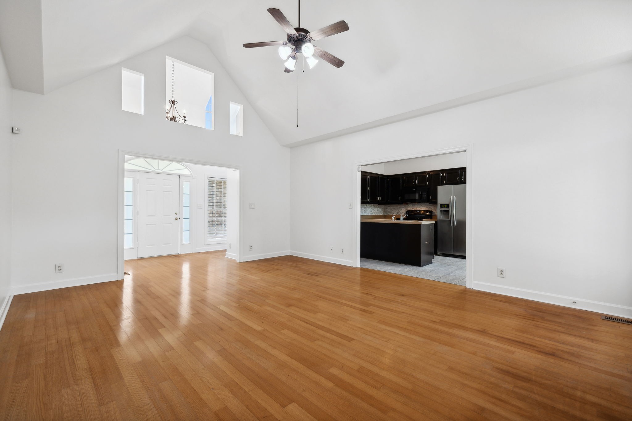 3575 Rabbit Run Trail Clarksville, TN 37043 - Photo 11 of 46 a view of an empty room with a kitchen and a window