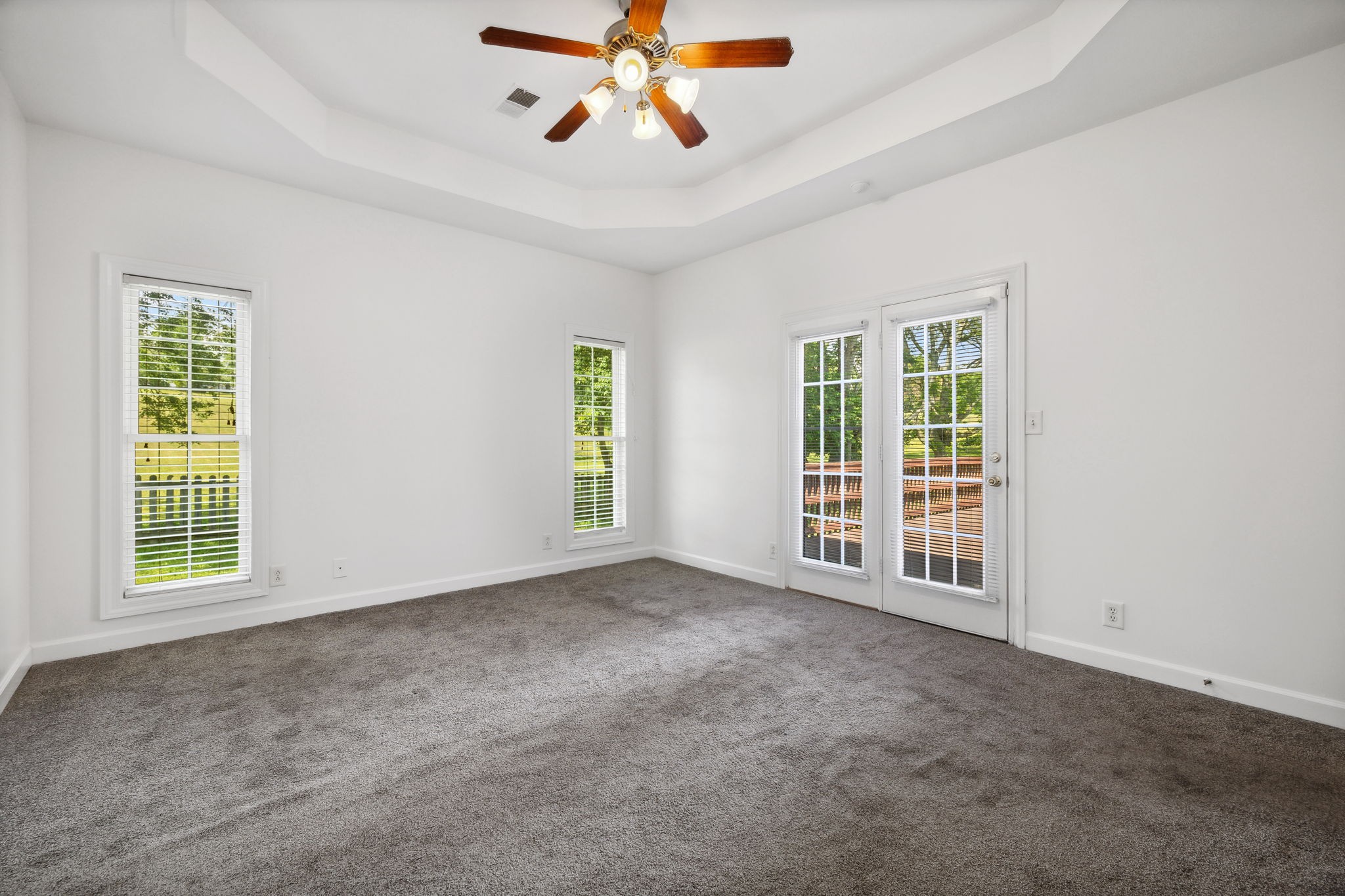 3575 Rabbit Run Trail Clarksville, TN 37043 - Photo 15 of 46 an empty room with windows and chandelier fan