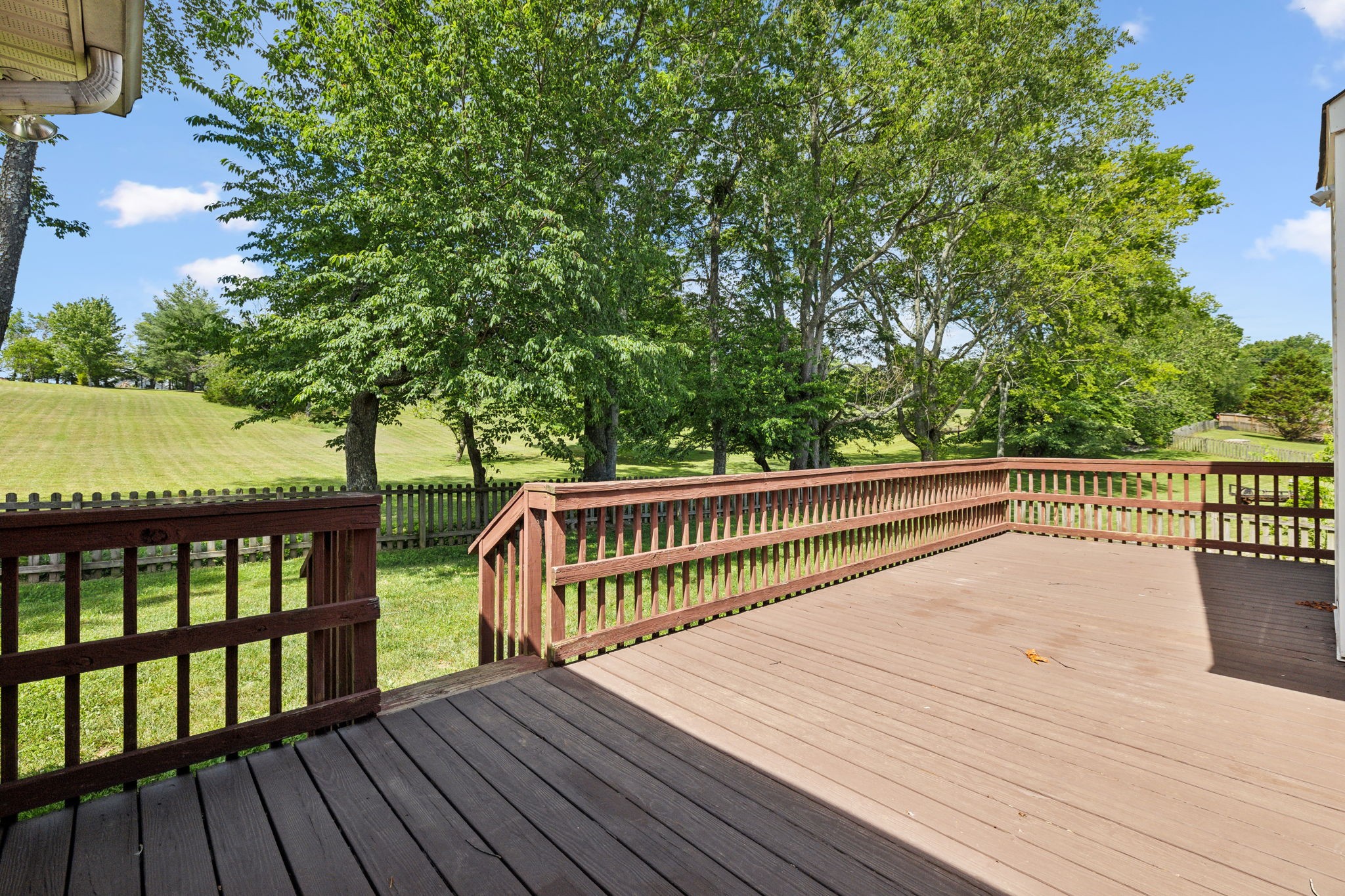 3575 Rabbit Run Trail Clarksville, TN 37043 - Photo 32 of 46 a balcony with wooden floor and trees