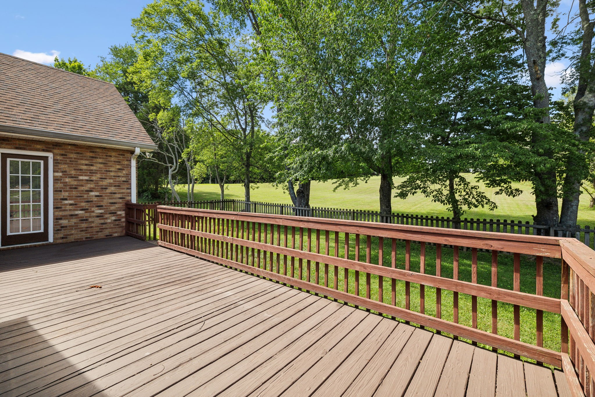 3575 Rabbit Run Trail Clarksville, TN 37043 - Photo 34 of 46 a view of a wooden deck and a yard