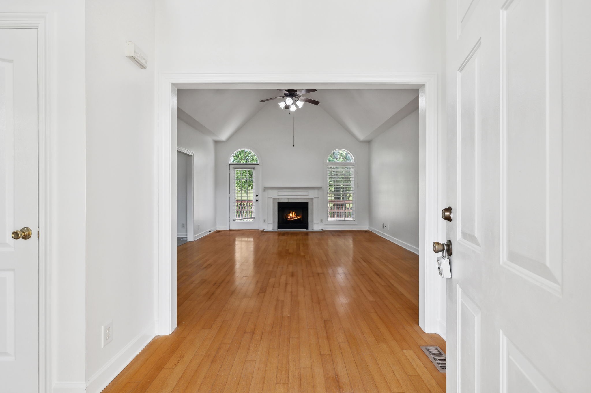 3575 Rabbit Run Trail Clarksville, TN 37043 - Photo 5 of 46 a view of empty room with wooden floor and fireplace
