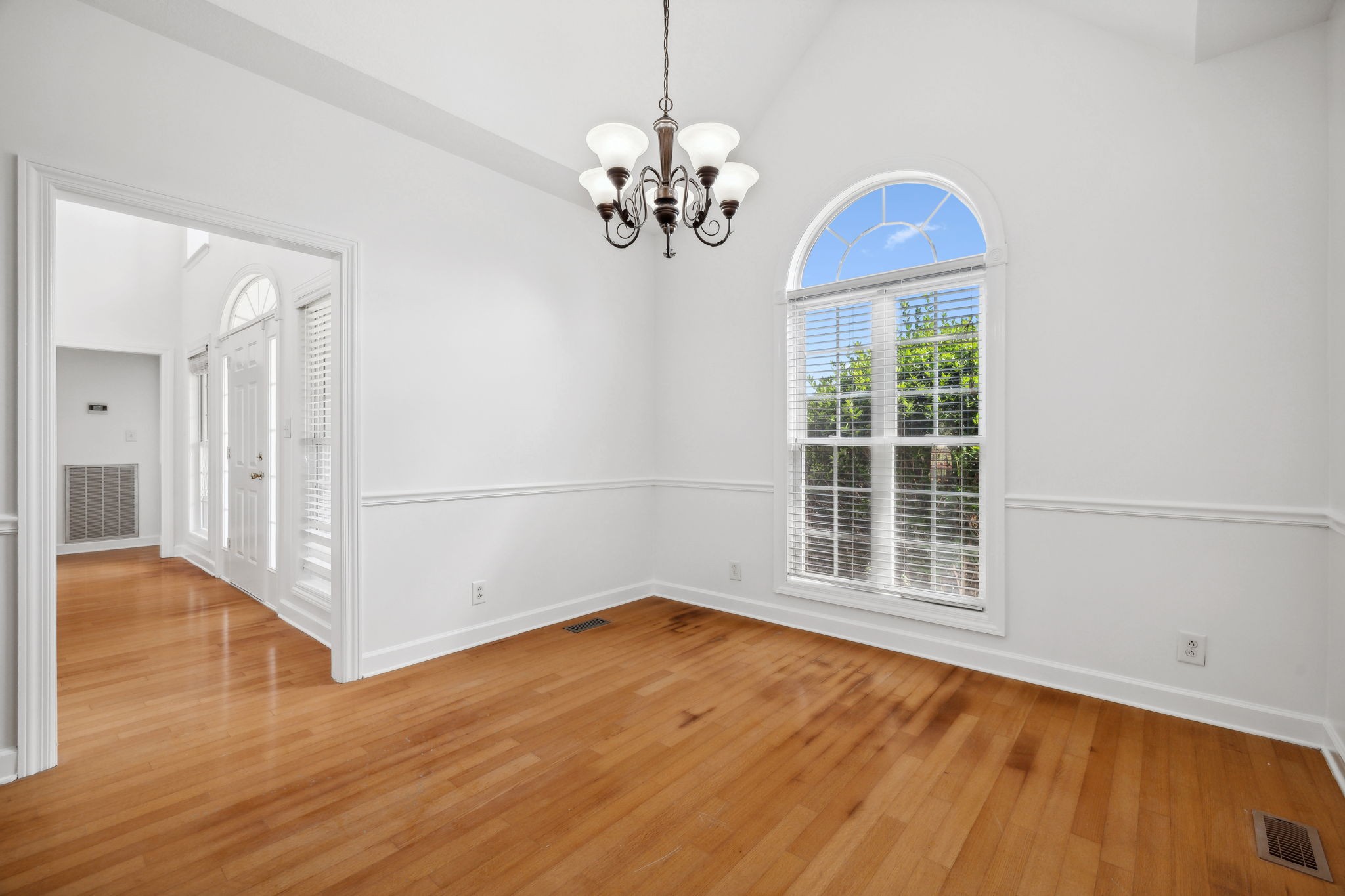 3575 Rabbit Run Trail Clarksville, TN 37043 - Photo 9 of 46 a view of an empty room with wooden floor and a window