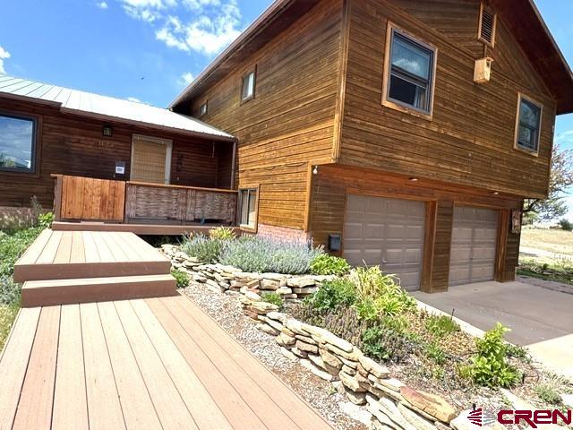 921 North Market Street Cortez, CO 81321 - Photo 2 of 45 a front view of a house with a yard