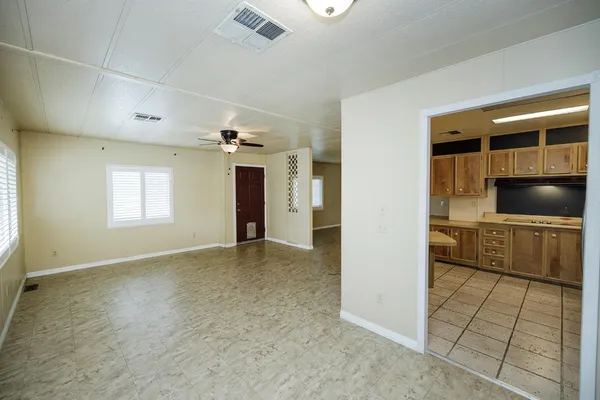 a view of a kitchen with a sink and cabinets
