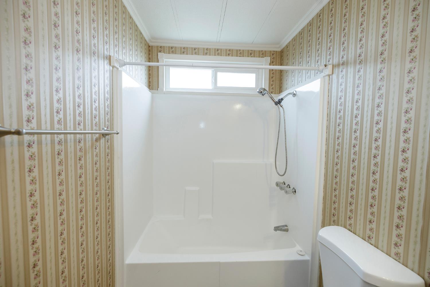 3924 Lahaina Lane Modesto, CA 95355 - Photo 18 of 32 a bathroom with a glass shower door