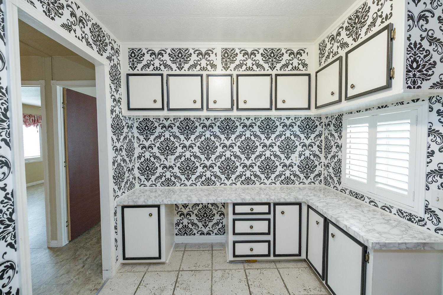 3924 Lahaina Lane Modesto, CA 95355 - Photo 19 of 32 a bathroom with a granite countertop sink and a mirror