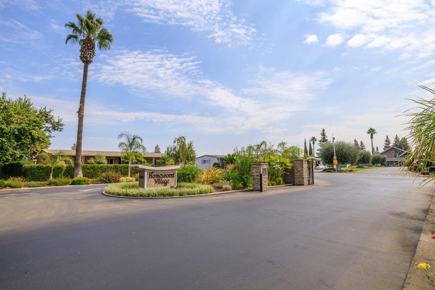 3924 Lahaina Lane Modesto, CA 95355 - Photo 2 of 32 a view of a street with a cars parked in front of it