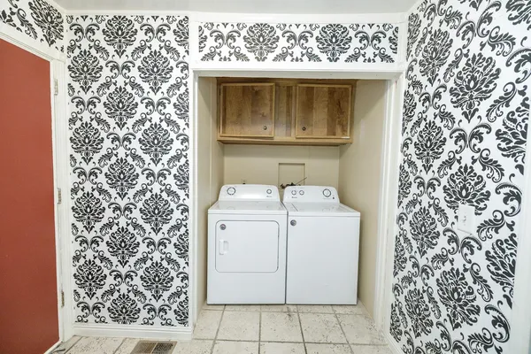 a bathroom with a sink and mirror with bathtub