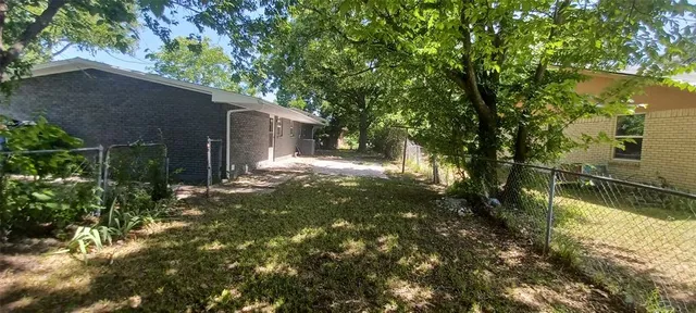 a backyard of a house with lots of green space