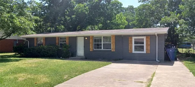 a house view with a garden space