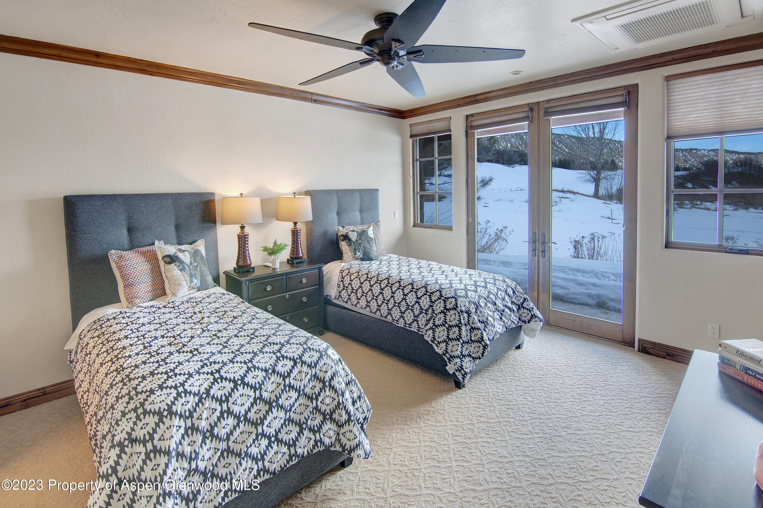 160 River Glen Road Carbondale, CO 81623 - Photo 16 of 24 a bedroom with two beds and painted walls