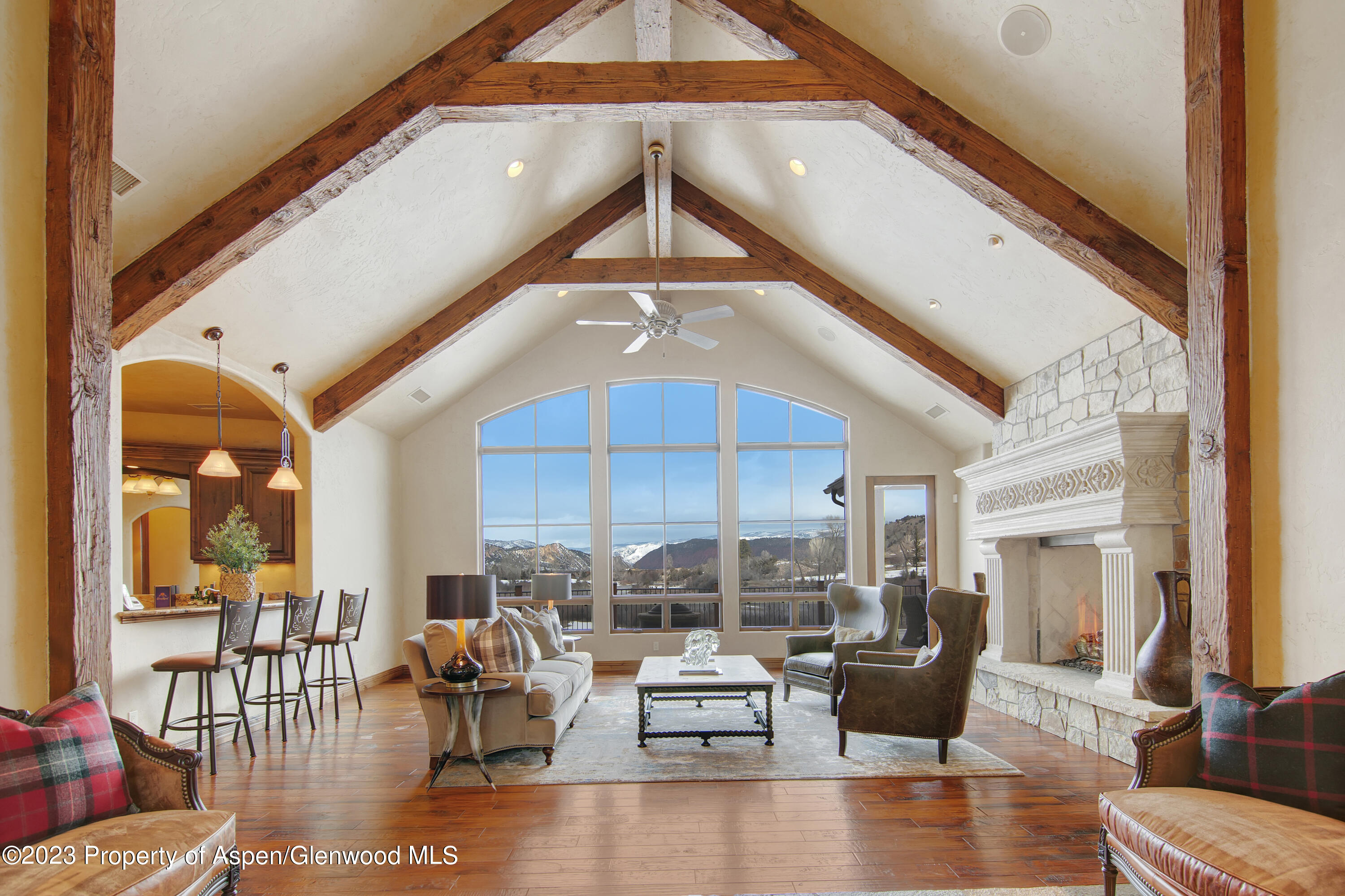 160 River Glen Road Carbondale, CO 81623 - Photo 2 of 24 a living room with fireplace furniture and a large window