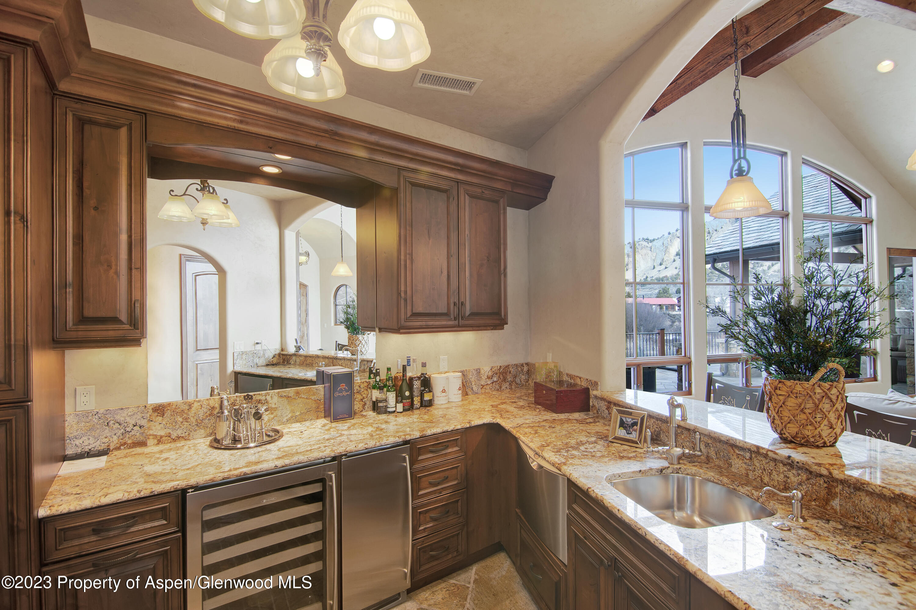 160 River Glen Road Carbondale, CO 81623 - Photo 6 of 24 a bathroom with a granite countertop sink and a large mirror