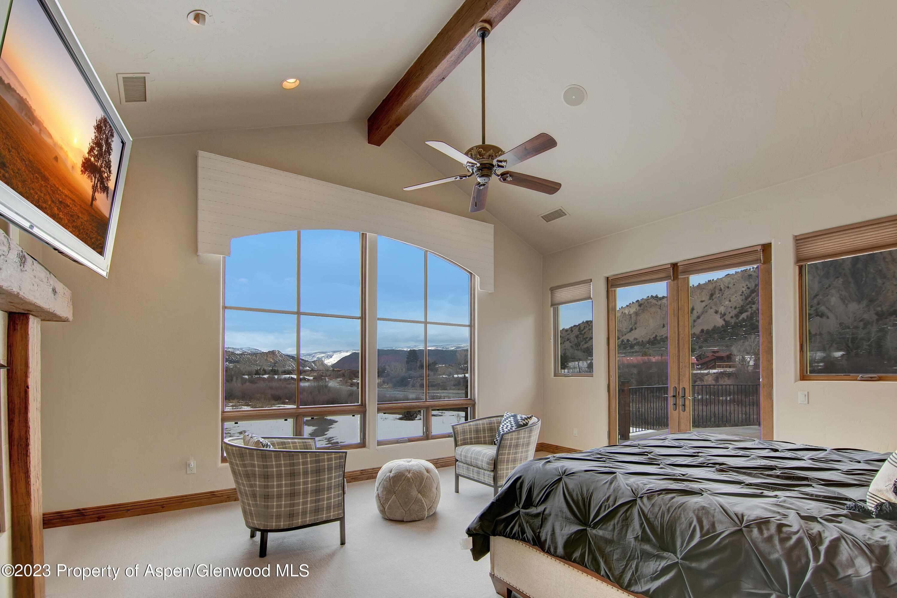 160 River Glen Road Carbondale, CO 81623 - Photo 8 of 24 a bedroom with furniture and large windows