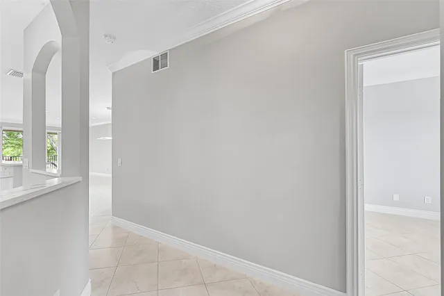 a view of a kitchen with a sink and a refrigerator