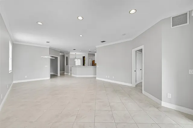 a kitchen with cabinets stainless steel appliances and sink