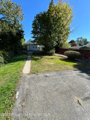 a swimming pool with wooden fence