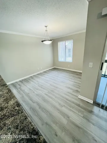 a kitchen with stainless steel appliances kitchen island granite countertop a refrigerator stove top oven and sink